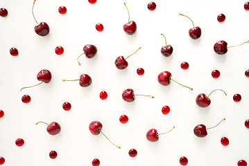 Image showing Sweet cherries and cherry candies on white background