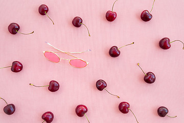 Image showing Cherries and round pink sunglasses