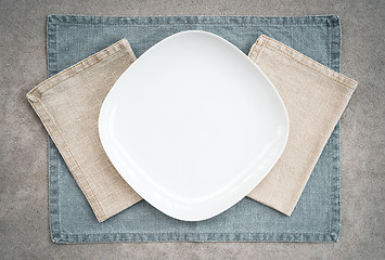 Image showing White plate and linen napkins in pastel colors