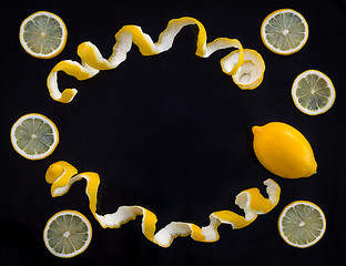 Image showing Lemons and spiral peel on black background