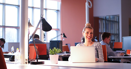 Image showing businesswoman using a laptop in startup office