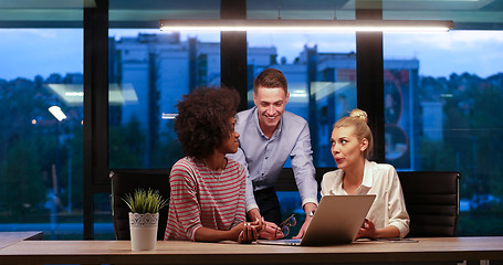 Image showing Multiethnic startup business team in night office