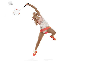 Image showing Young woman playing badminton over white background