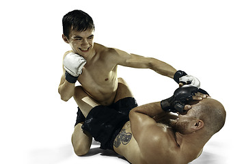 Image showing Two professional boxer boxing isolated on white studio background