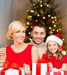 Image showing happy family with christmas gifts at home