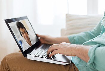 Image showing man having video call with helpline operator