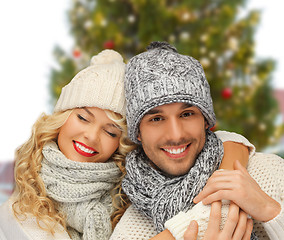 Image showing happy couple hugging over christmas tree