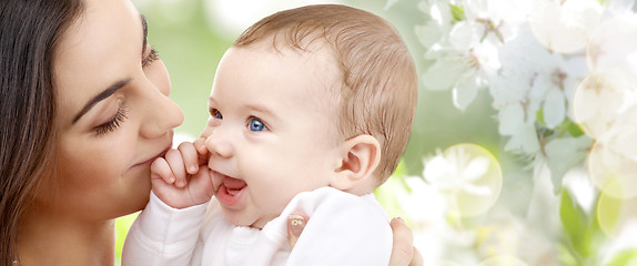 Image showing mother with baby over cherry blossom background