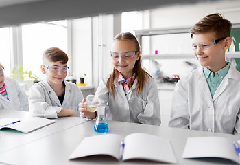 Image showing kids with test tube studying chemistry at school