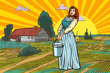 Image showing rural woman with a bucket of water or milk. farm landscape