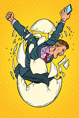 Image showing startup business birth concept. businessman appears from the shell of an egg