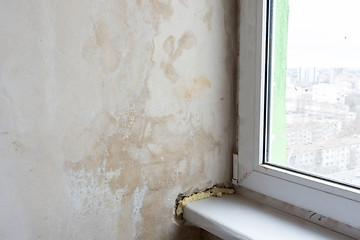 Image showing Damp wall and poor installation of plastic windows