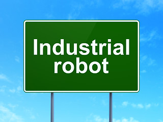 Image showing Manufacuring concept: Industrial Robot on road sign background