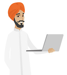 Image showing Hindu businessman using laptop.