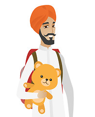 Image showing Hindu traveler man holding teddy bear.