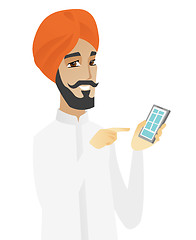 Image showing Hindu businessman holding mobile phone.