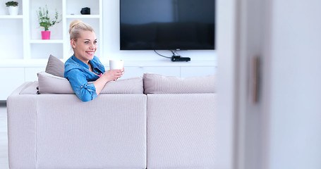 Image showing woman enjoying a cup of coffee