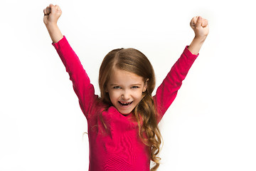 Image showing Happy success teen girl celebrating being a winner. Dynamic energetic image of female model