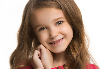 Image showing The happy teen girl standing and smiling against white background.