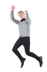 Image showing Handsome man in shirt and bow-tie jumping