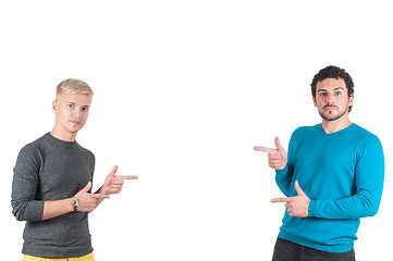 Image showing Two handsome guys showing somewhere with fingers