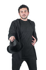 Image showing Man in black with his black hat