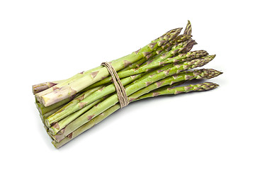 Image showing Bunch of fresh raw garden asparagus isolated on white background