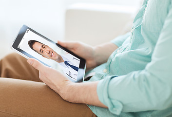 Image showing patient having video chat with doctor on tablet pc