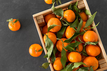 Image showing close up of mandarins on slate table top