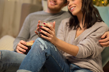 Image showing close up of happy couple drinking coffee at home