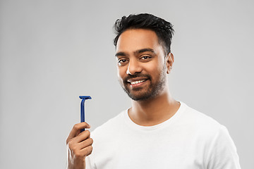 Image showing indian man shaving beard with razor blade