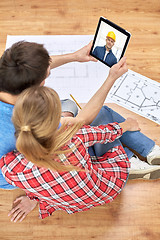 Image showing couple having video call with builder