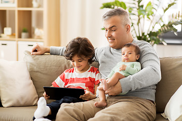 Image showing happy father with preteen and baby son at home