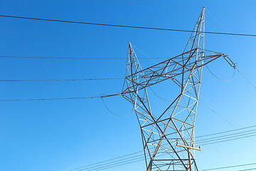 Image showing transmission tower and power line over blue sky