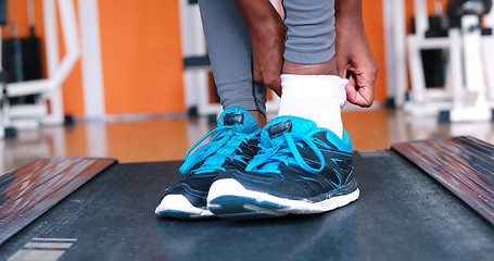 Image showing black female feet in sneakers
