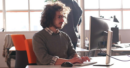 Image showing businessman working using a computer in startup office