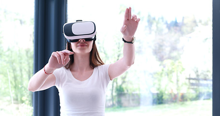 Image showing woman using VR-headset glasses of virtual reality