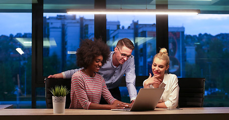 Image showing Multiethnic startup business team in night office