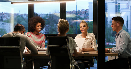 Image showing Multiethnic startup business team in night office