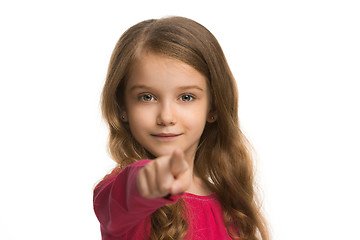 Image showing The teen girl pointing to you, half length closeup portrait on white background.