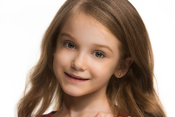 Image showing The happy teen girl standing and smiling against white background.