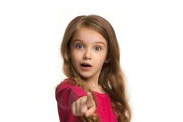 Image showing The teen girl pointing to you, half length closeup portrait on white background.