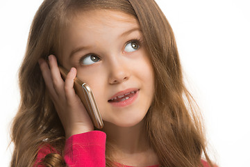 Image showing The happy teen girl standing and smiling against white background.