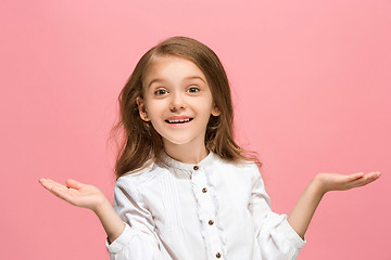 Image showing Beautiful teen girl looking suprised isolated on pink