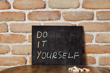 Image showing Black chalkboard with the phrase DO IT YOURSELF drown by hand on