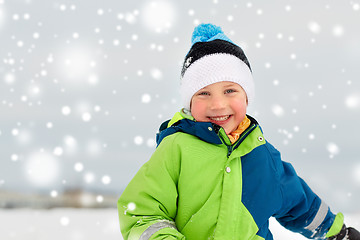 Image showing happy little boy in winter clothes outdoors