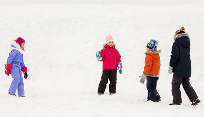 Image showing happy little kids playing outdoors in winter