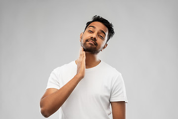 Image showing indian man touching his beard