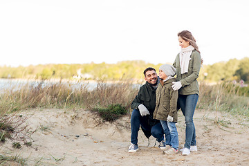 Image showing happy family at autumn beach