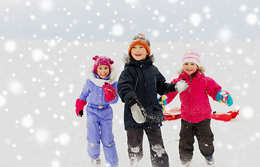 Image showing happy little kids playing outdoors in winter